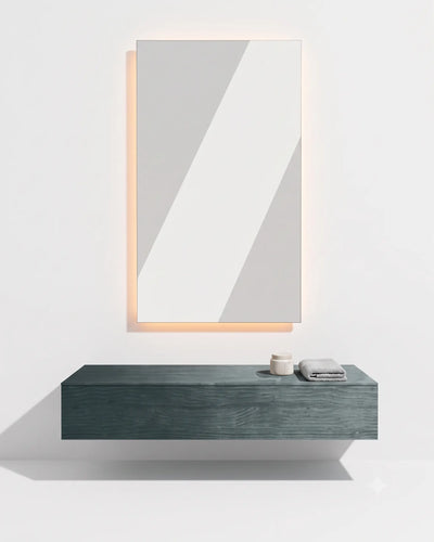 A modern floating bathroom vanity with a dark teal wood-grain finish and a matching rectangular wall mirror above it, set against a clean white background with warm ambient lighting.